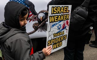 A child joins other protesters as they gather in Times Square for an Al Quds Day rally in support of Palestinians and against the current bombing of Iran by both the United States and Israel on March 13, 2026 in New York City